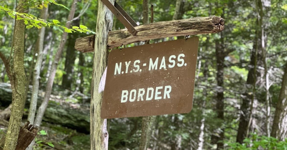 a sign in the woods